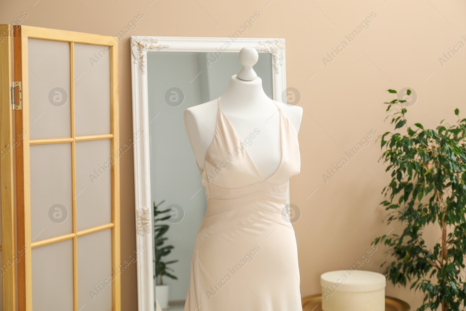 Photo of Beautiful wedding dress on mannequin in boutique