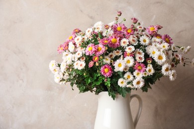 Photo of Vase with beautiful flowers on gray background, closeup