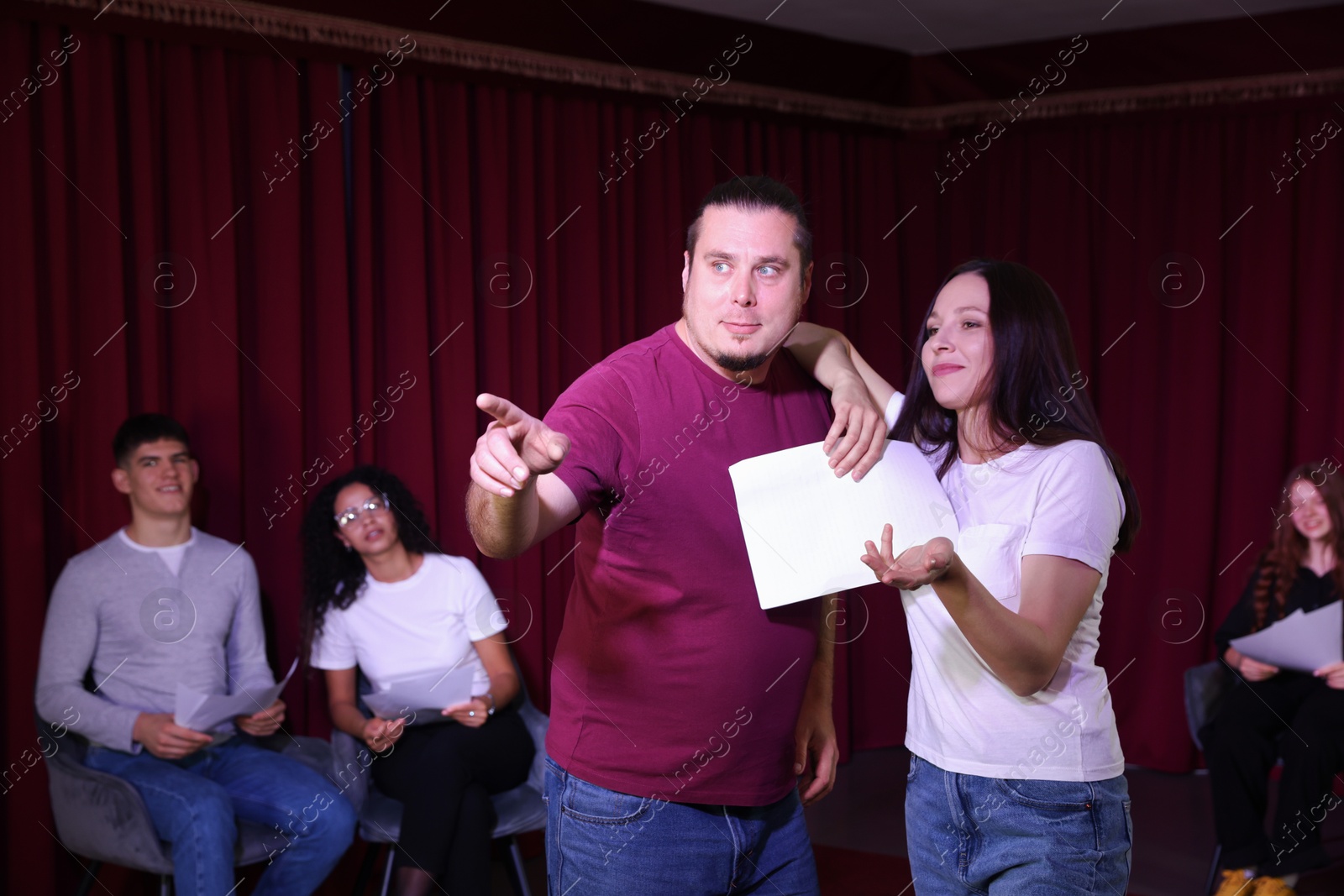 Photo of Professional actors rehearsing on stage in theatre