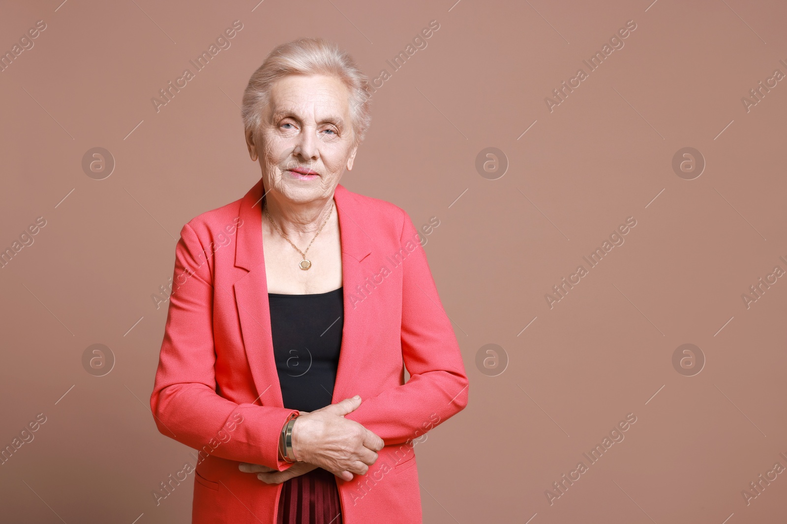 Photo of Portrait of senior woman on color background. Space for text