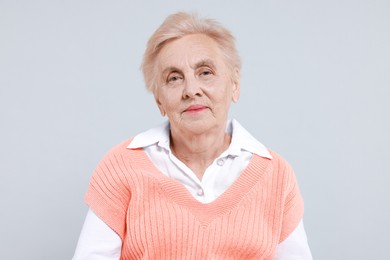 Photo of Portrait of senior woman on light background