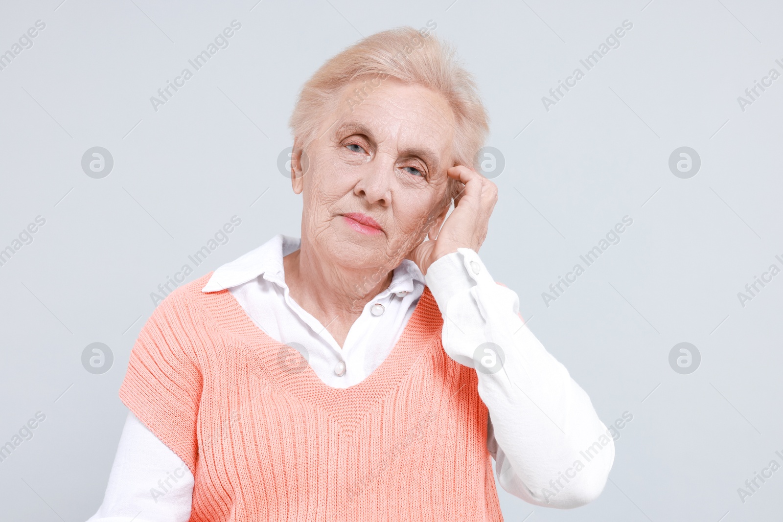 Photo of Portrait of senior woman on light background