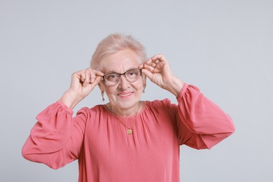 Photo of Portrait of senior woman on light background