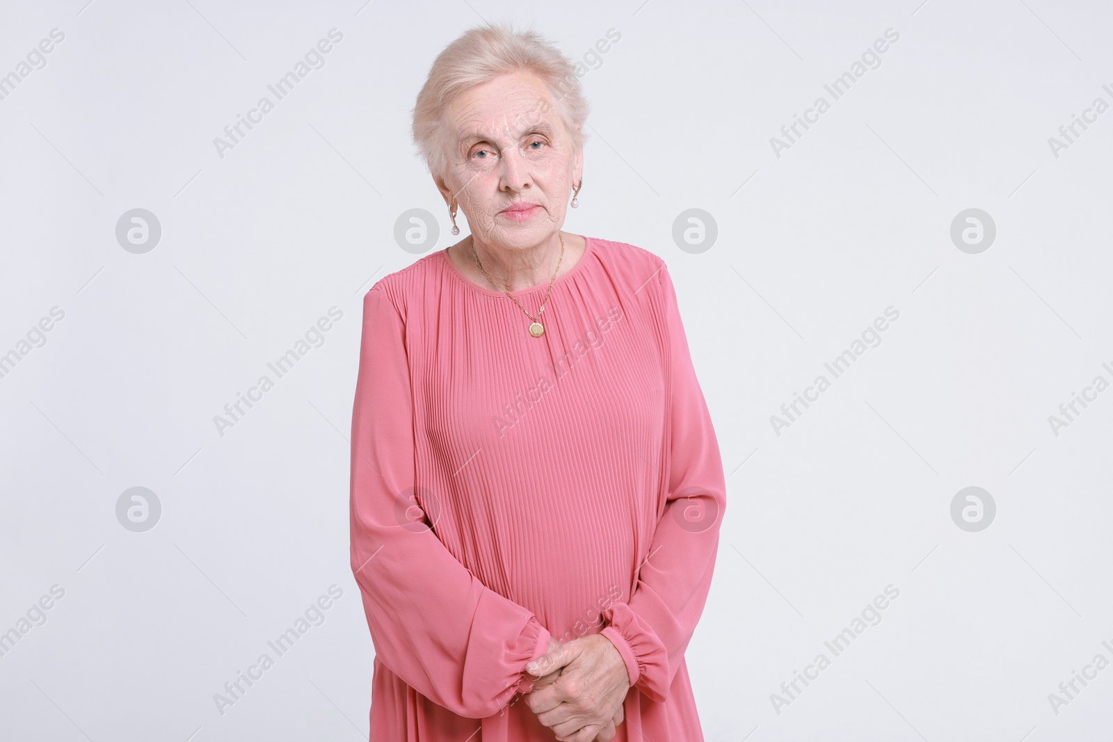 Photo of Portrait of senior woman on white background