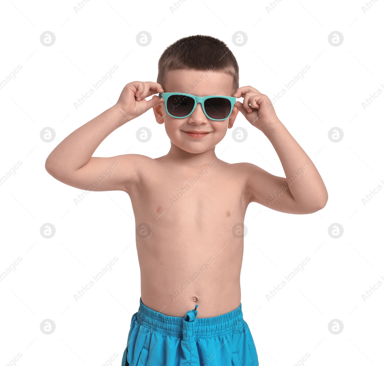 Photo of Cute little boy in beachwear on white background