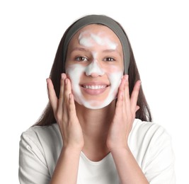 Teenage girl washing her face with cleanser on white background. Cosmetic product