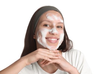 Photo of Teenage girl washing her face with cleanser on white background. Cosmetic product