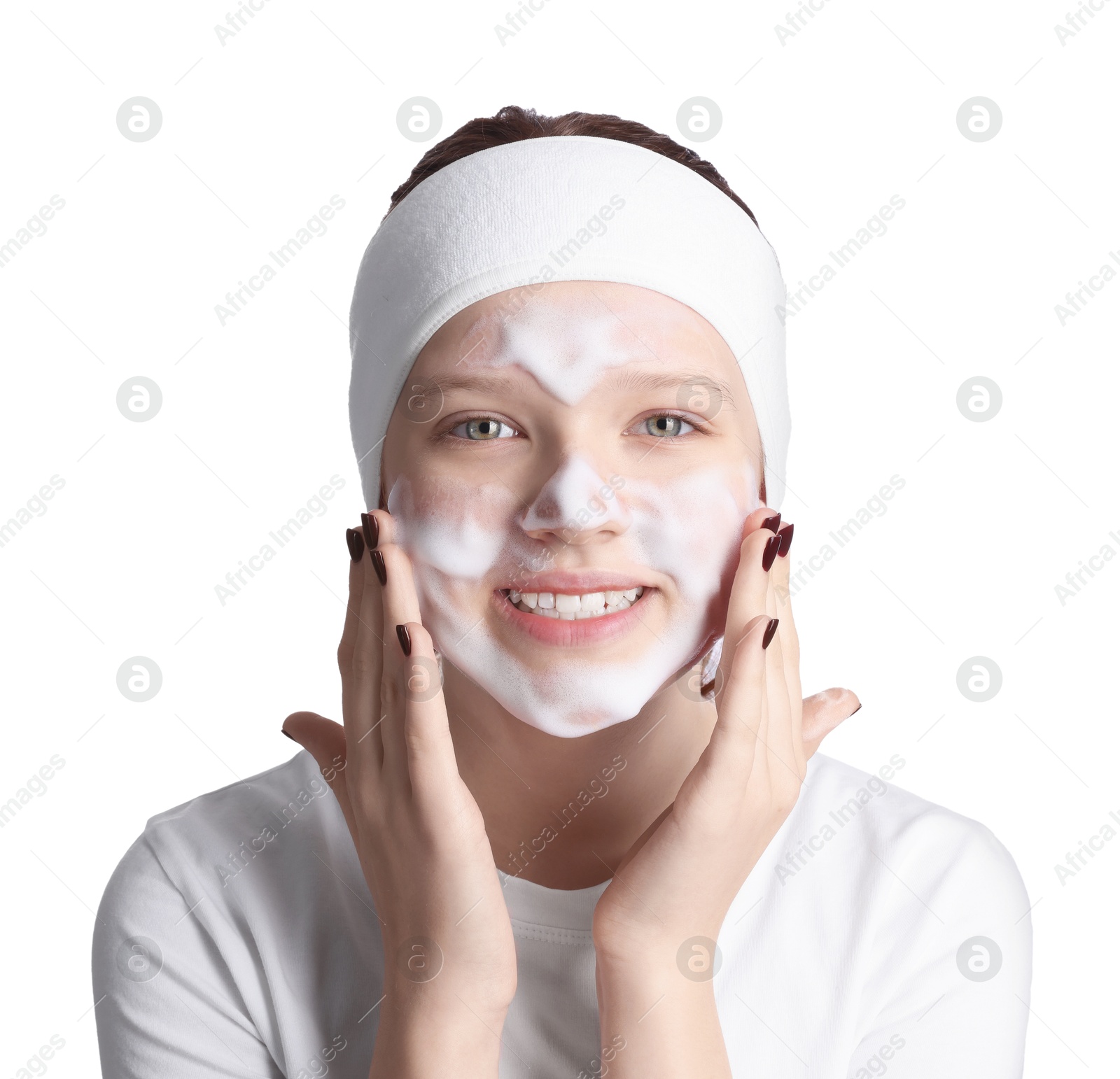 Photo of Teenage girl washing her face with cleanser on white background. Cosmetic product