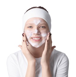 Teenage girl washing her face with cleanser on white background. Cosmetic product