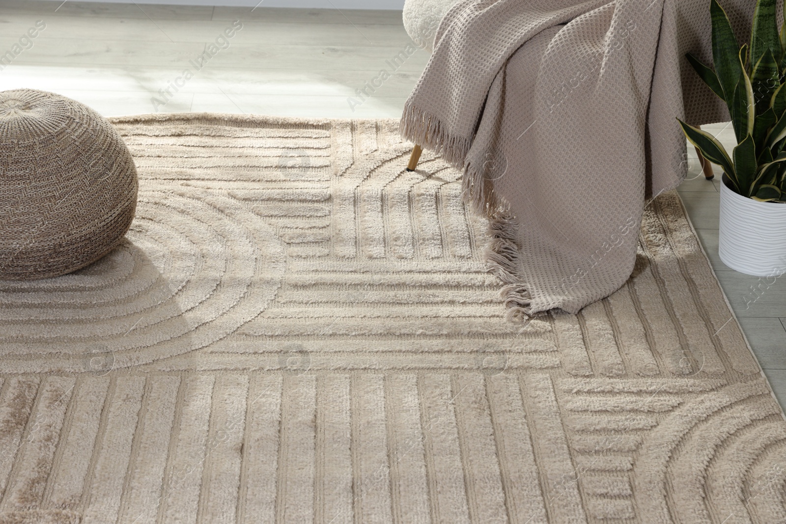 Stylish soft rug with pattern on floor in living room Photo of Stylish soft rug with pattern on floor in living room