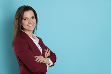 Photo of Banker with crossed arms on light blue background, space for text