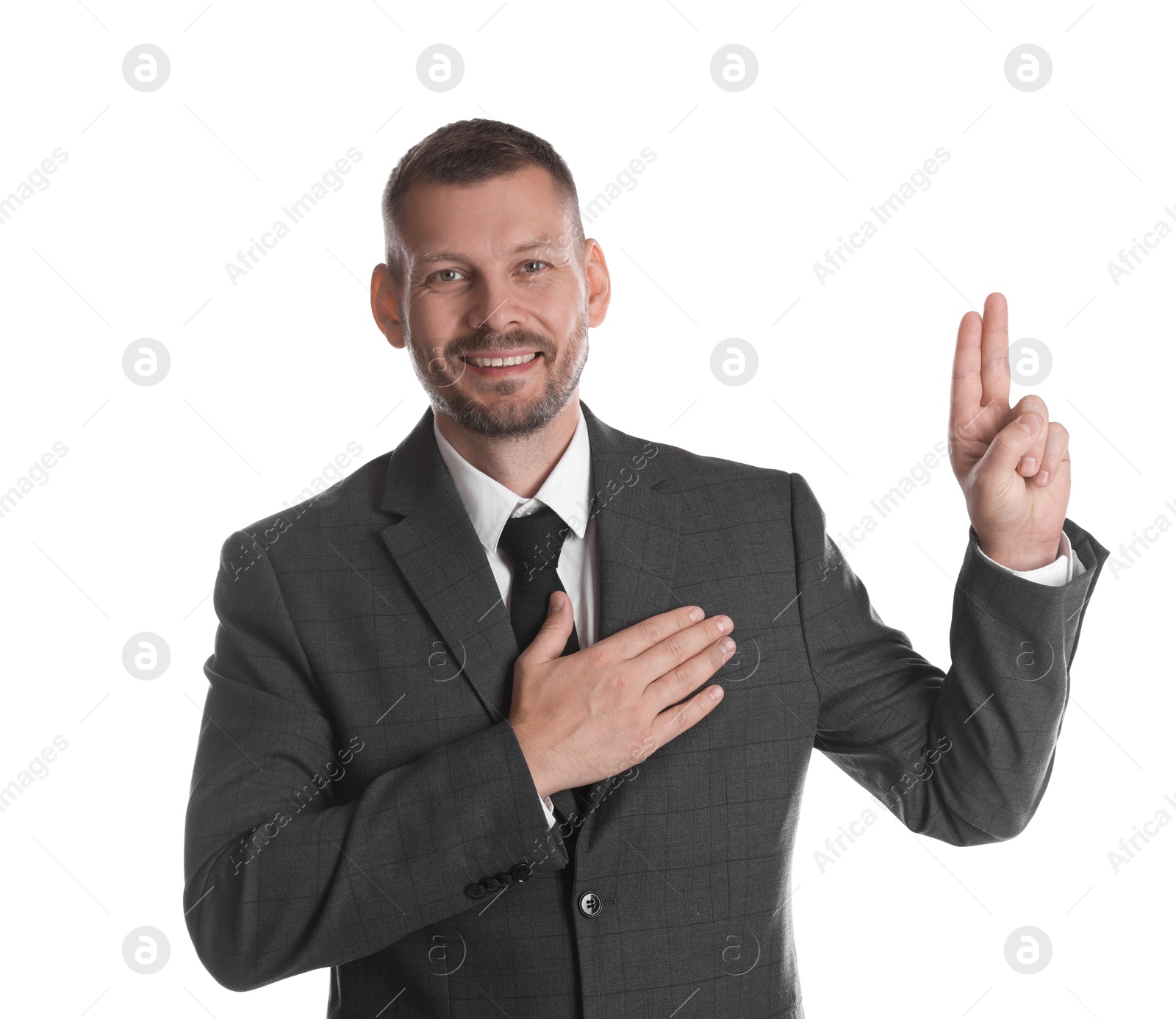 Photo of Man showing oath gesture on white background. Making promise