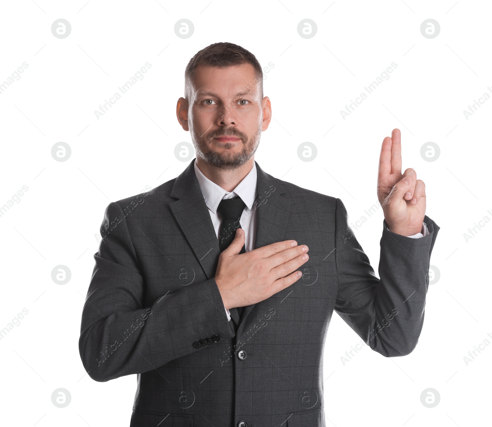 Photo of Man showing oath gesture on white background. Making promise