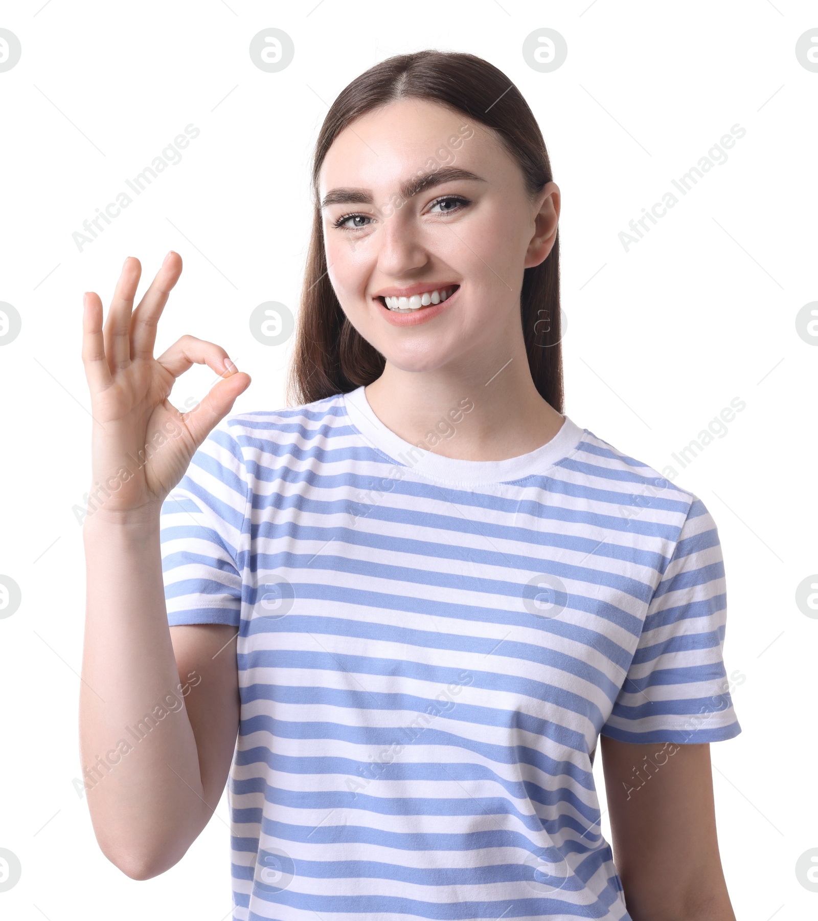 Photo of Happy young woman showing OK gesture on white background