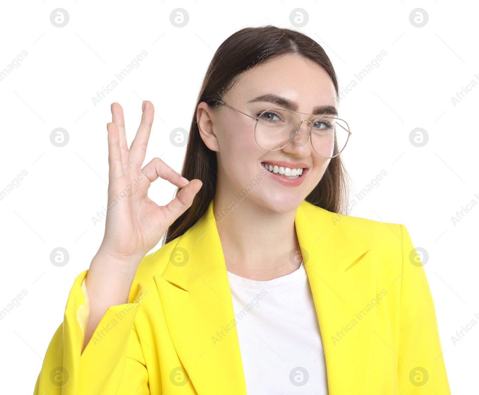 Photo of Happy young woman showing OK gesture on white background