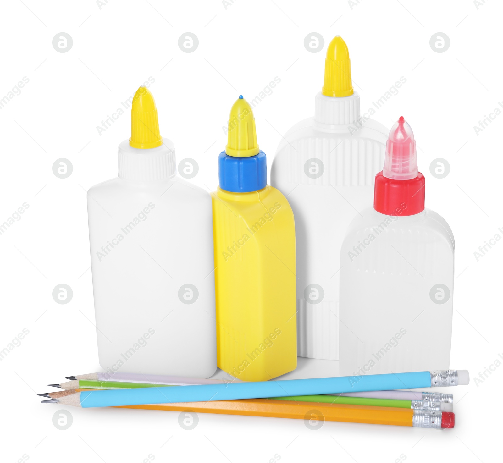 Photo of Bottles of glue and pencils isolated on white