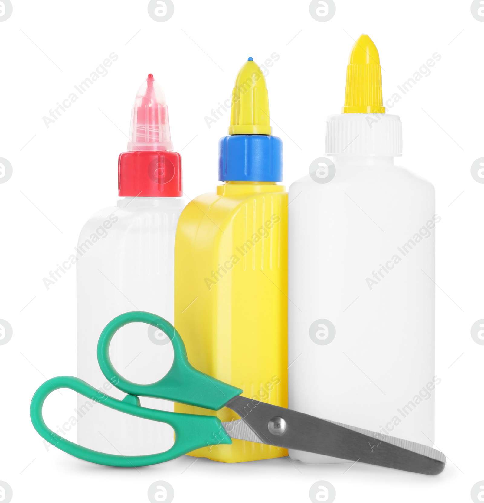 Photo of Bottles of glue and scissors isolated on white