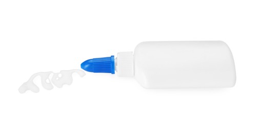 Photo of Bottle and stain of glue isolated on white