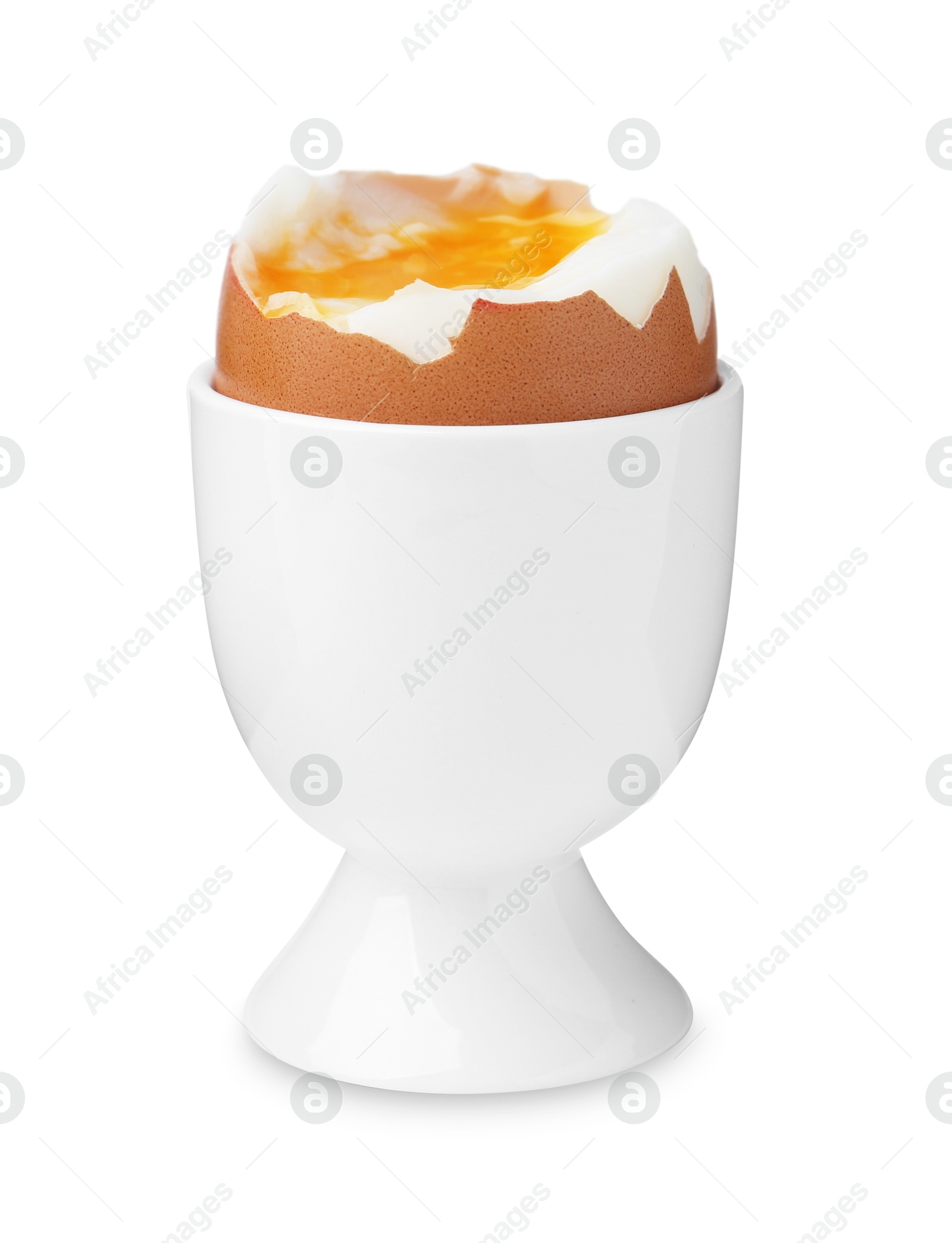 Photo of Soft boiled egg in eggcup isolated on white