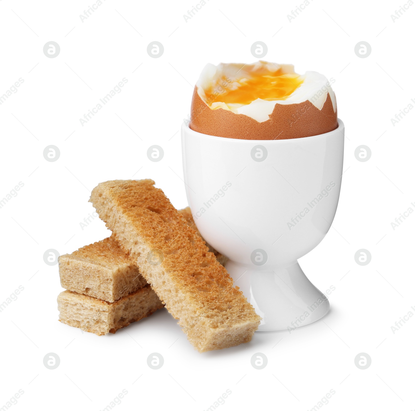 Photo of Soft boiled egg in eggcup with bread isolated on white