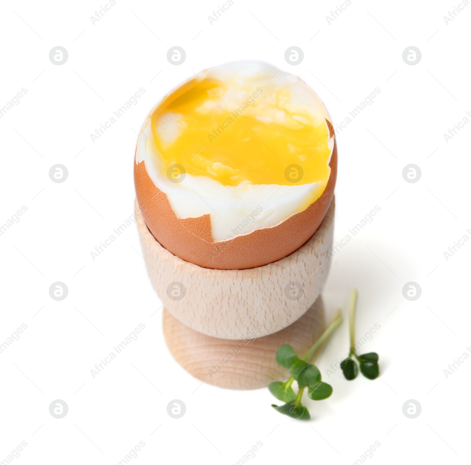 Photo of Soft boiled egg in eggcup isolated on white