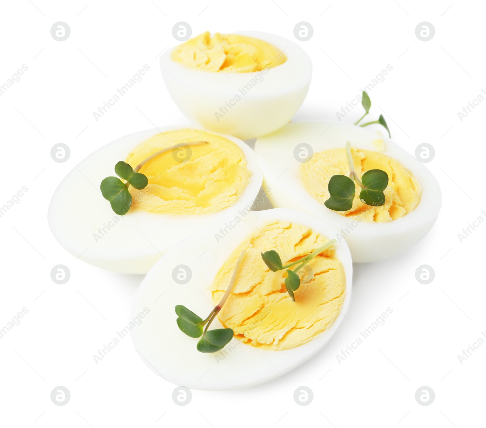 Photo of Halves of hard boiled eggs isolated on white