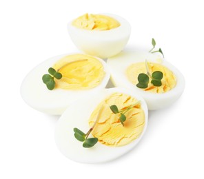 Photo of Halves of hard boiled eggs isolated on white