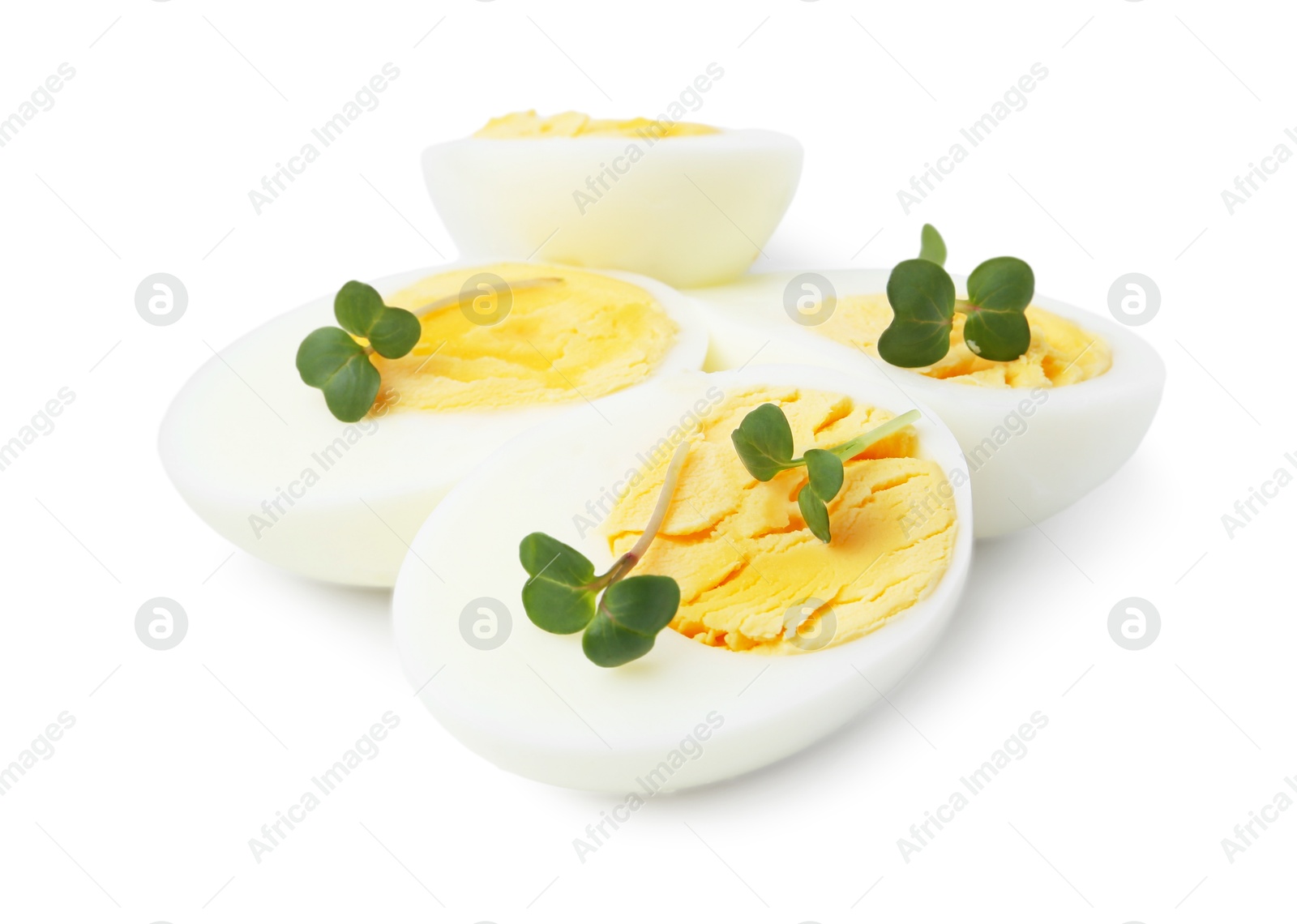 Photo of Halves of hard boiled eggs isolated on white