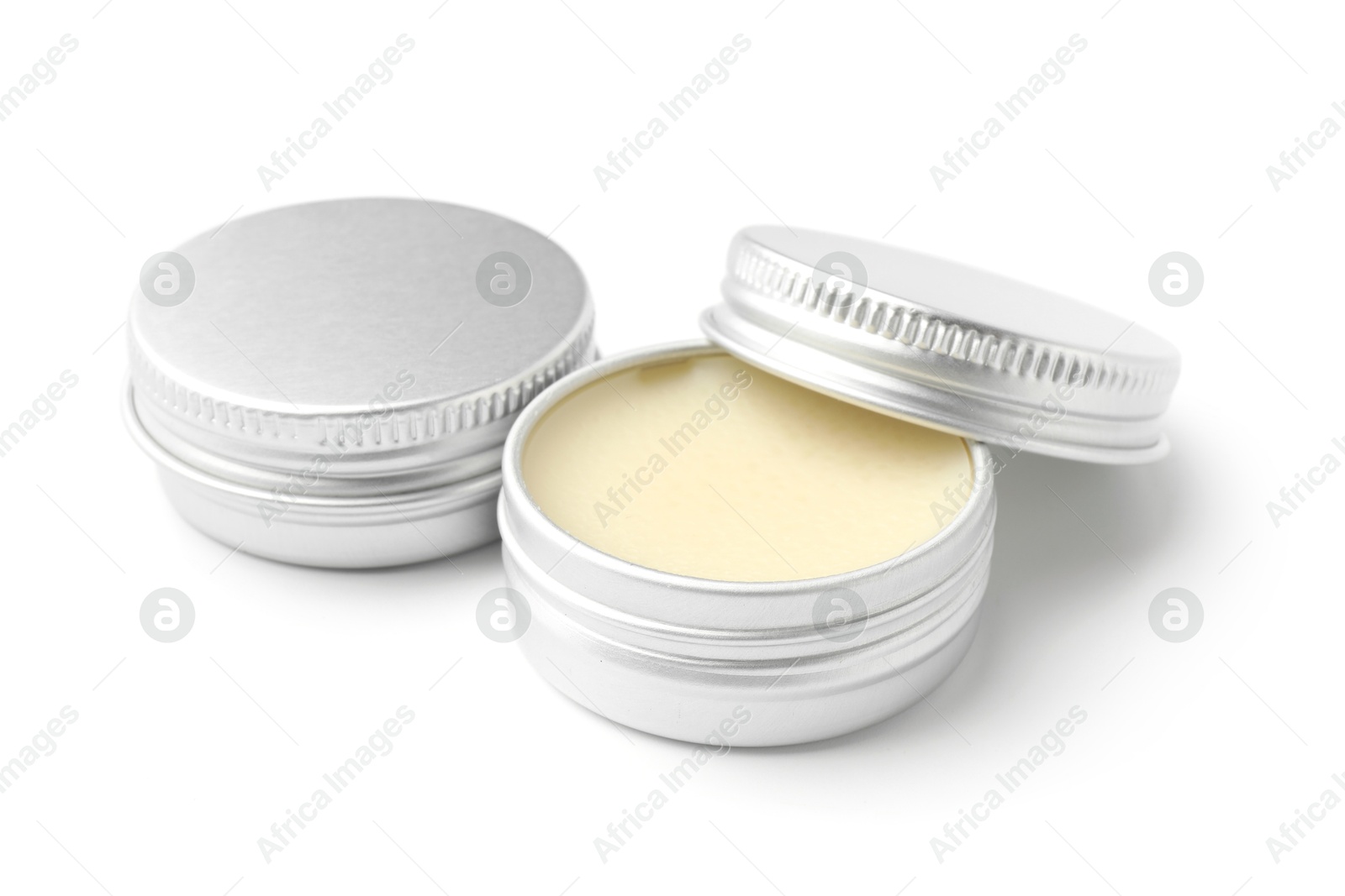 Photo of Lip balms isolated on white. Cosmetic product