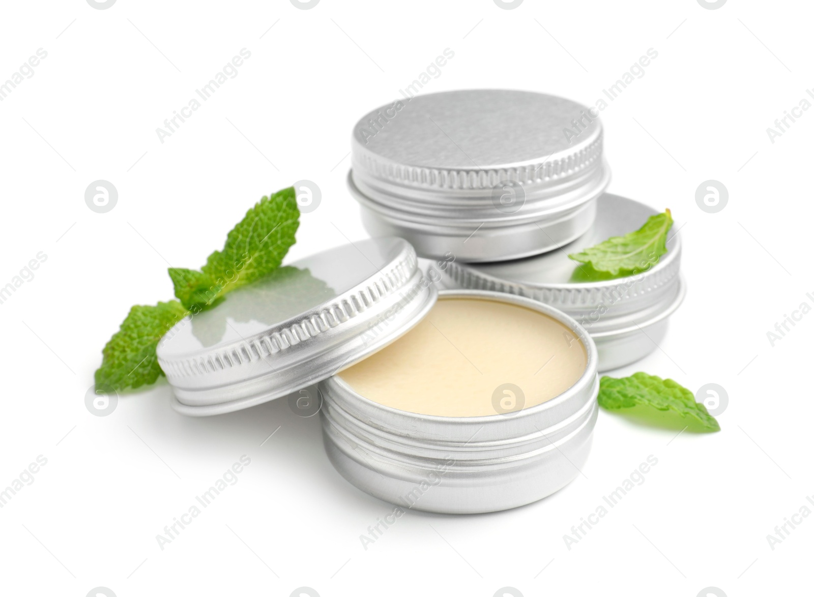 Photo of Mint lip balms and green leaves isolated on white. Cosmetic product