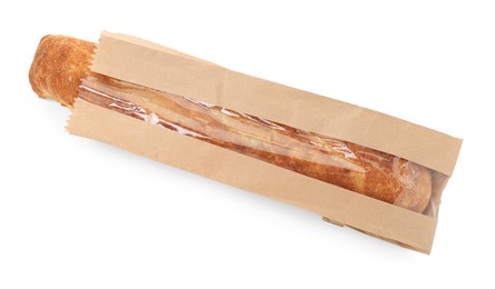 Photo of Fresh baguette in paper bag isolated on white, top view