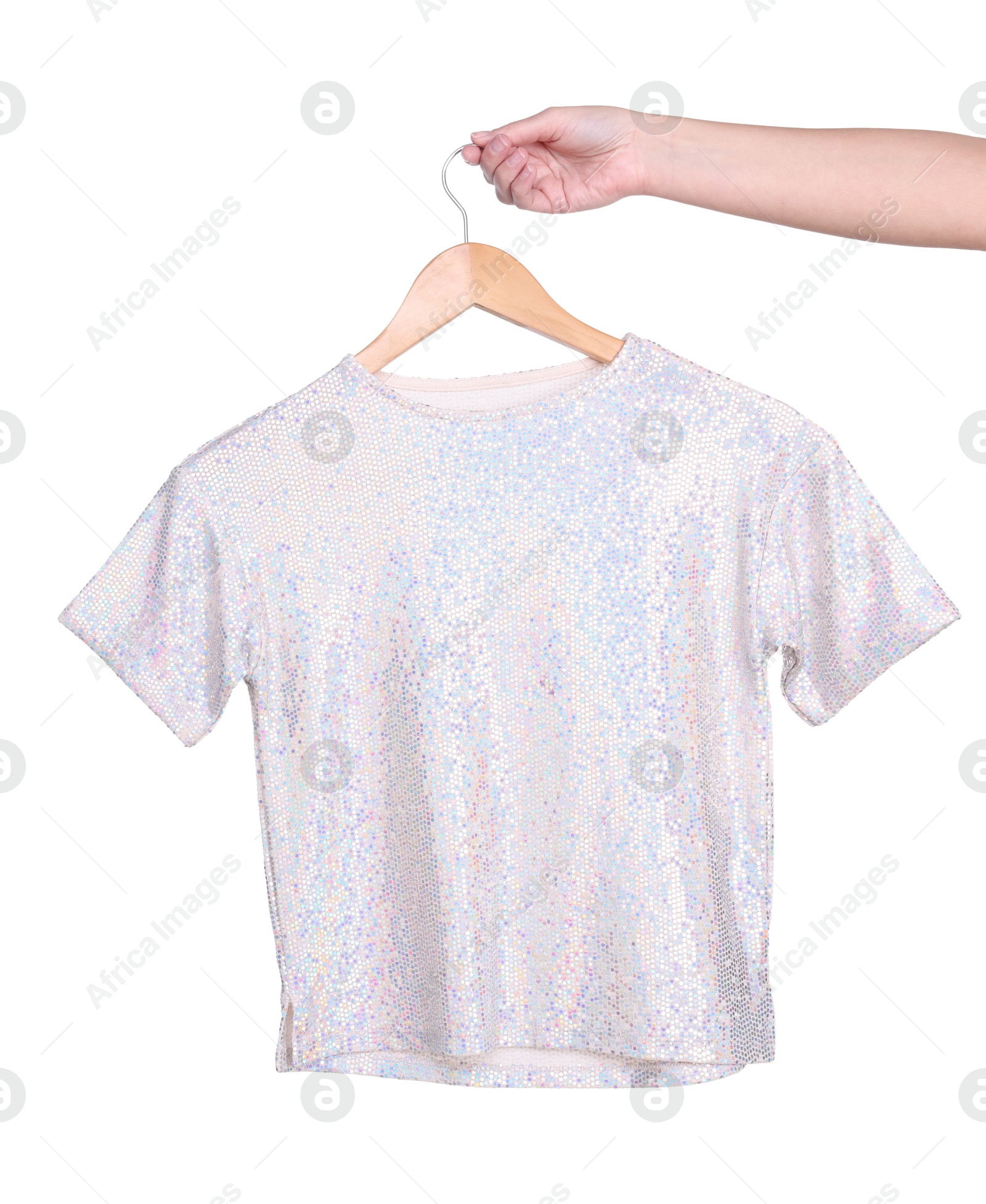 Photo of Woman holding hanger with stylish t-shirt on white background, closeup