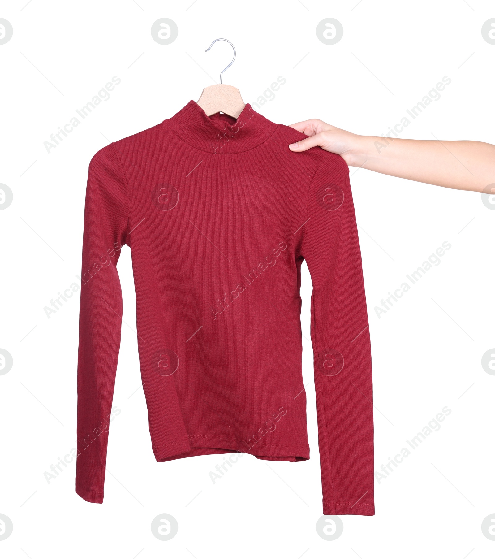 Photo of Woman holding hanger with red sweater on white background, closeup