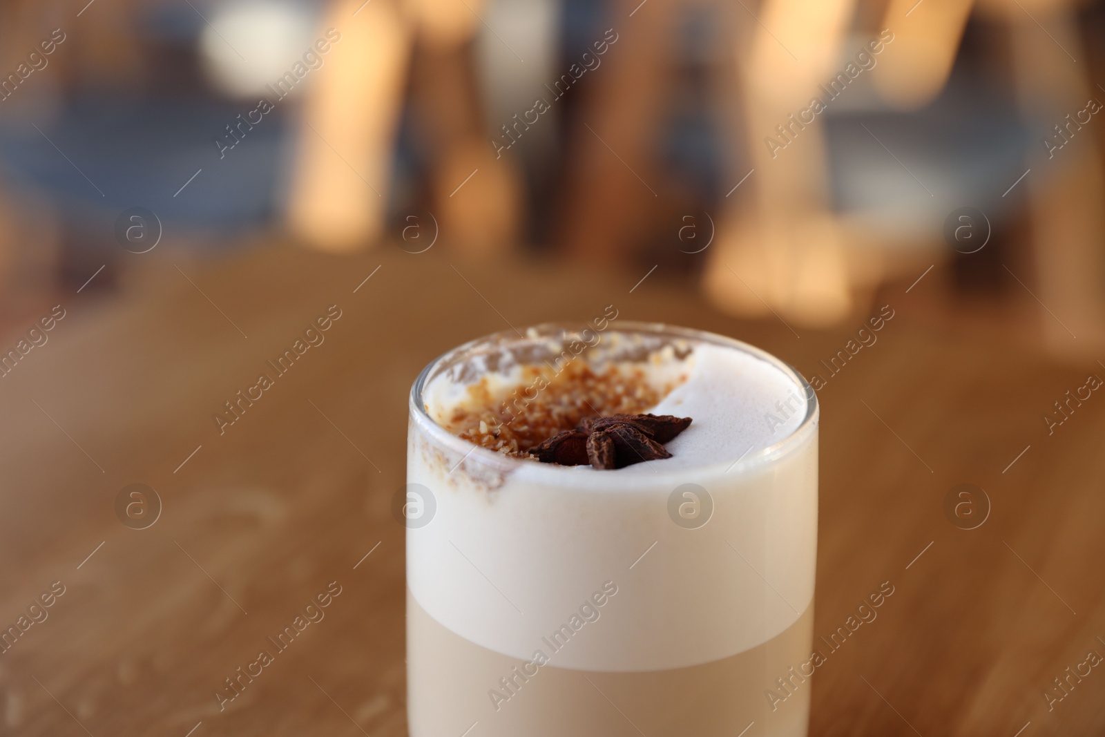 Photo of Glass of aromatic coffee on table in cafe, closeup. Space for text