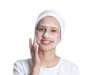 Photo of Teenage girl with cleansing foam on her face against white background. Acne treatment