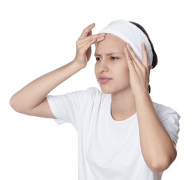 Photo of Upset teenage girl popping pimple on her face against white background. Acne problem