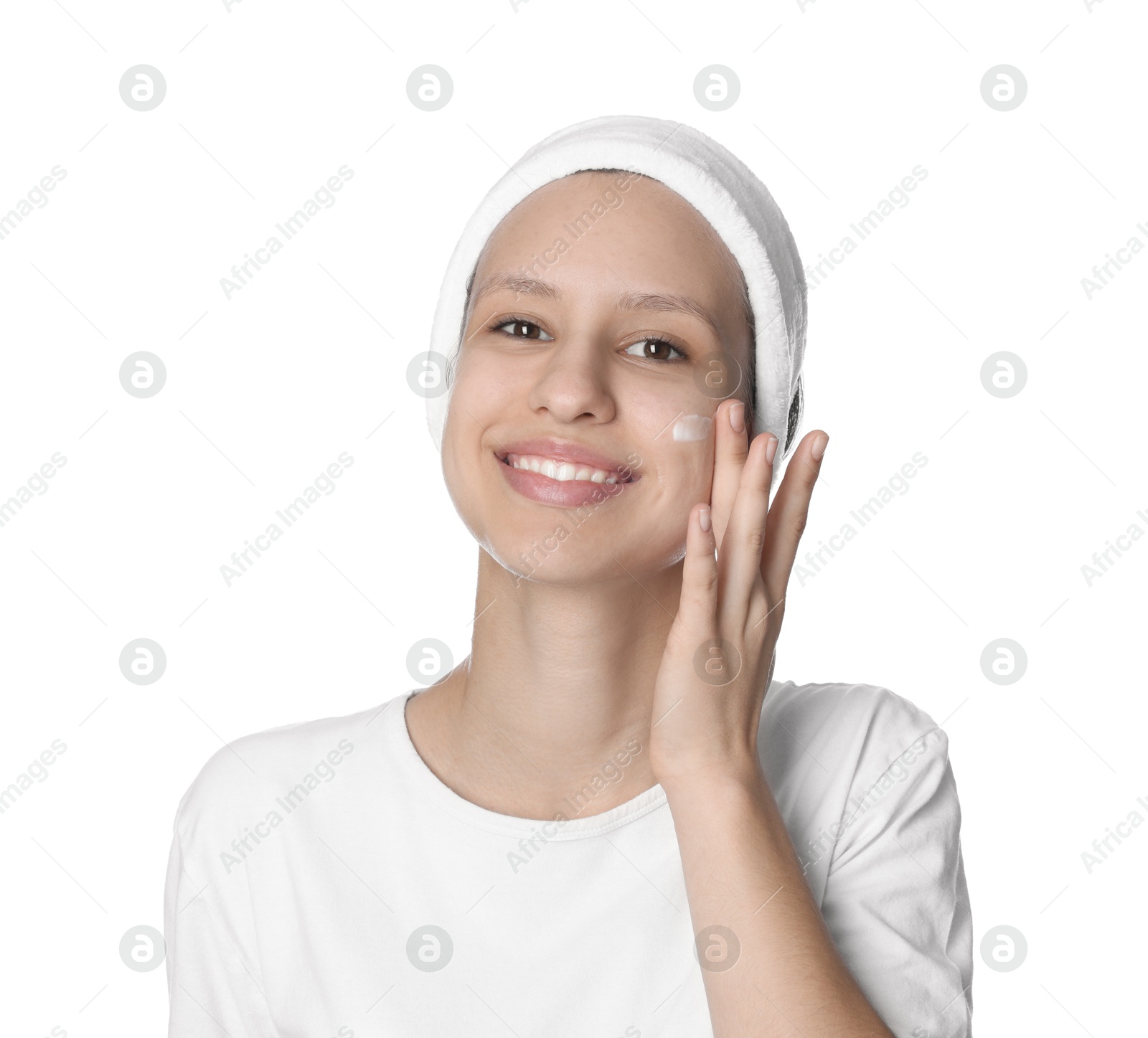 Photo of Teenage girl with acne problem applying cream on white background