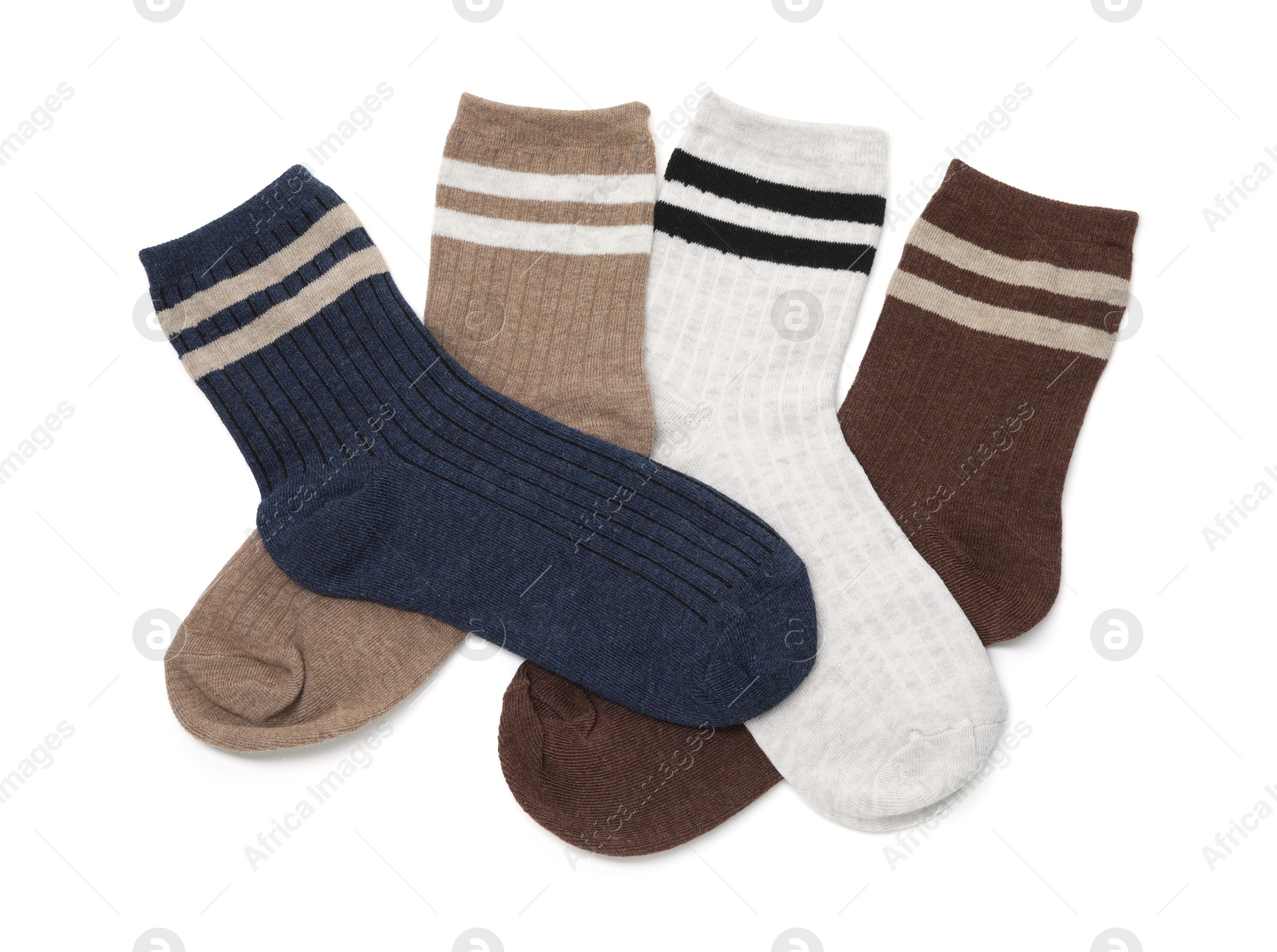 Photo of Different soft socks isolated on white, top view