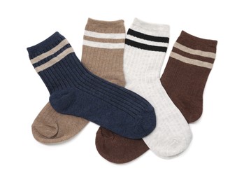 Photo of Different soft socks isolated on white, top view