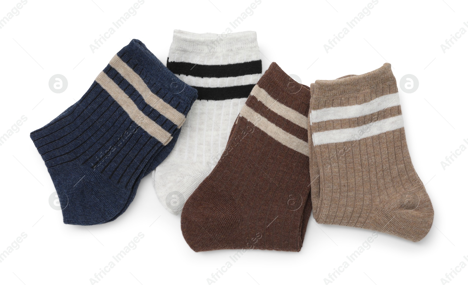 Photo of Pairs of folded soft socks isolated on white, top view