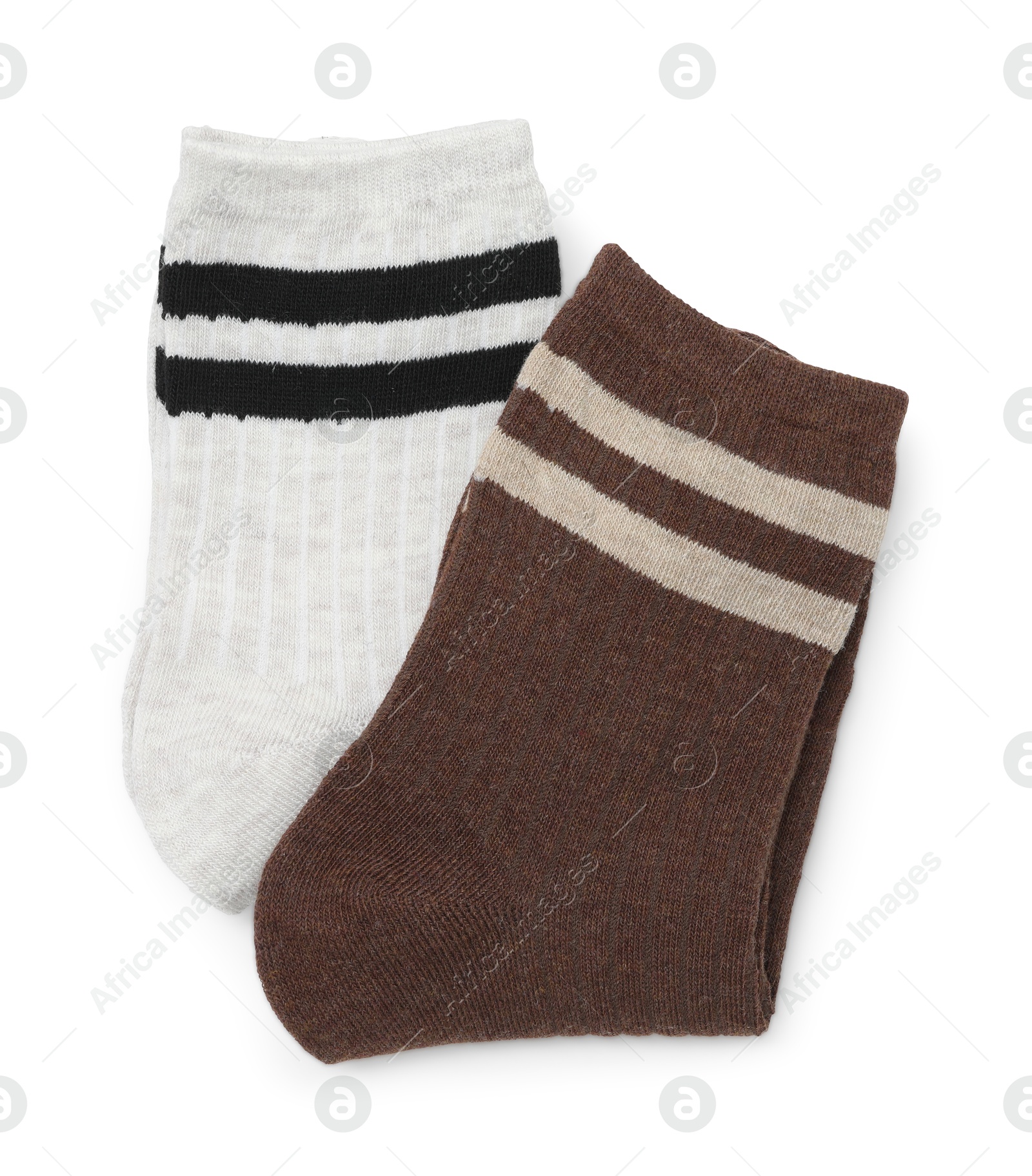 Photo of Pairs of folded soft socks isolated on white, top view