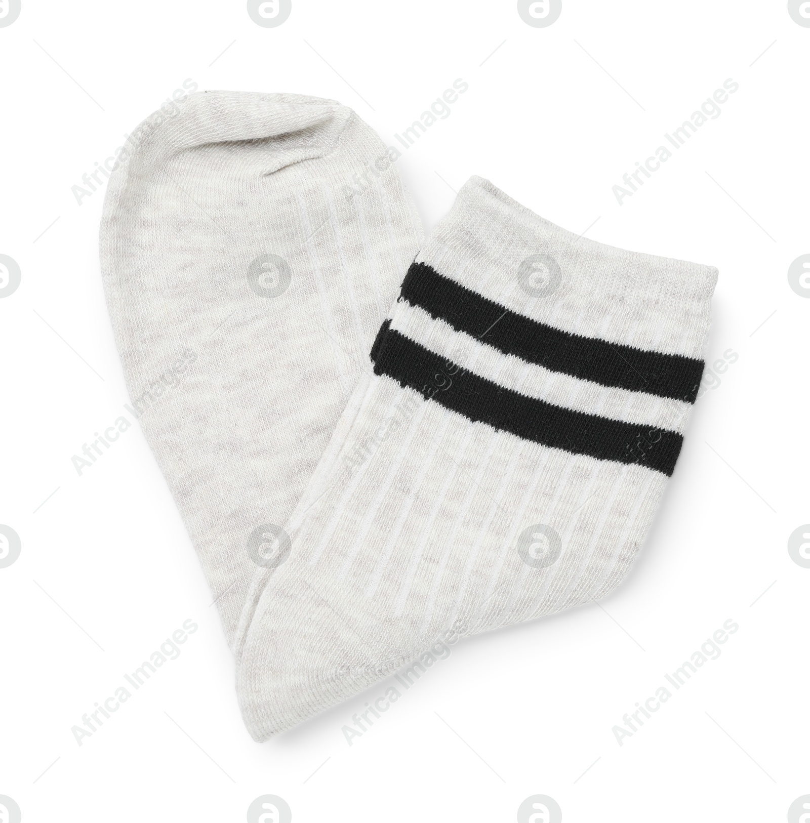 Photo of Pair of folded soft socks isolated on white, top view