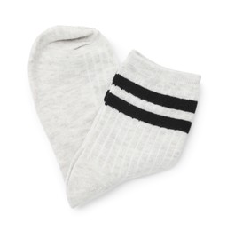 Photo of Pair of folded soft socks isolated on white, top view