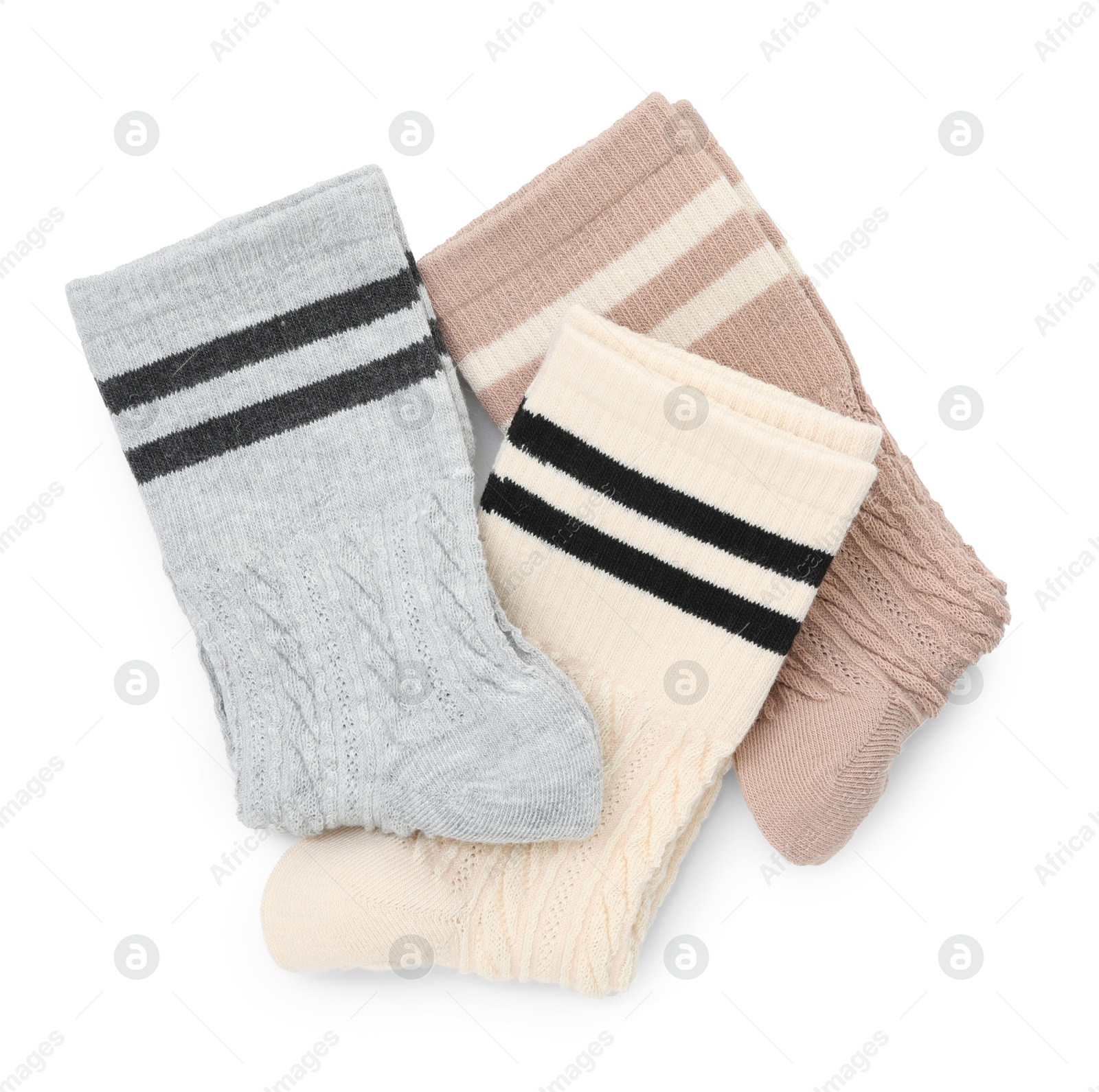 Photo of Different soft socks isolated on white, top view