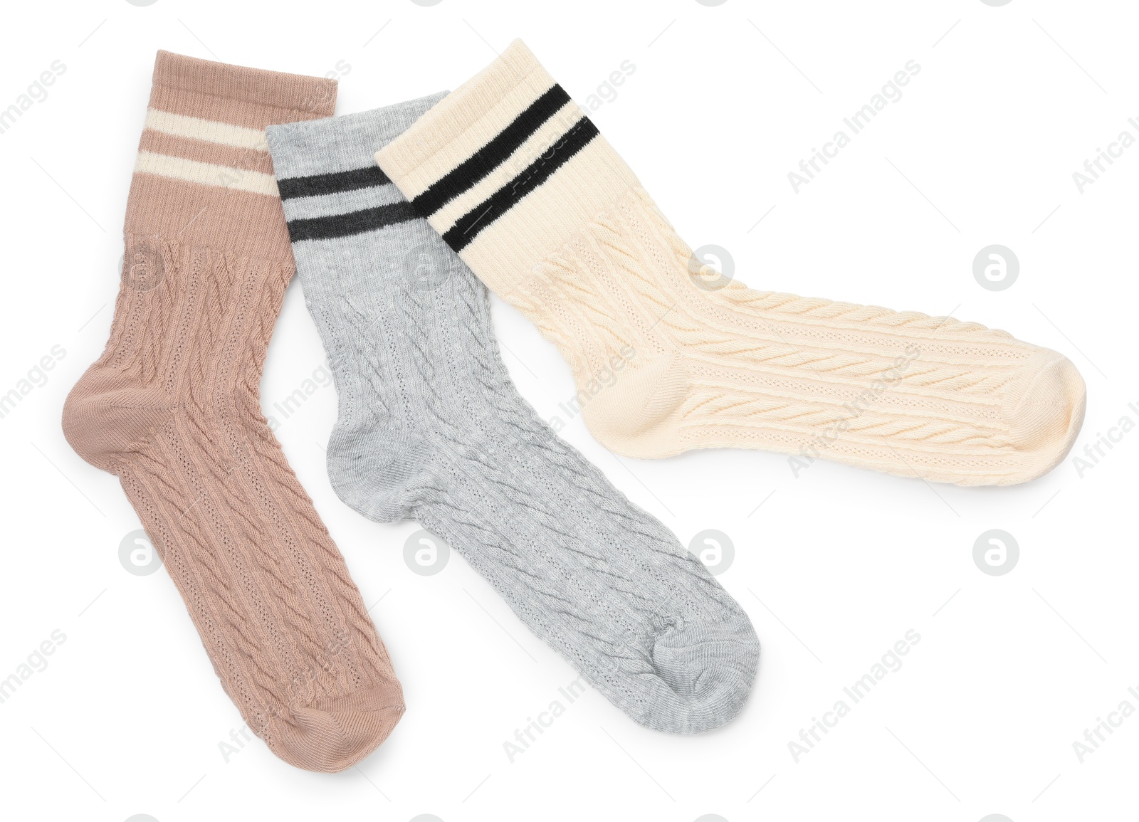 Photo of Different soft socks isolated on white, top view