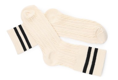 Photo of Pair of soft socks isolated on white, top view