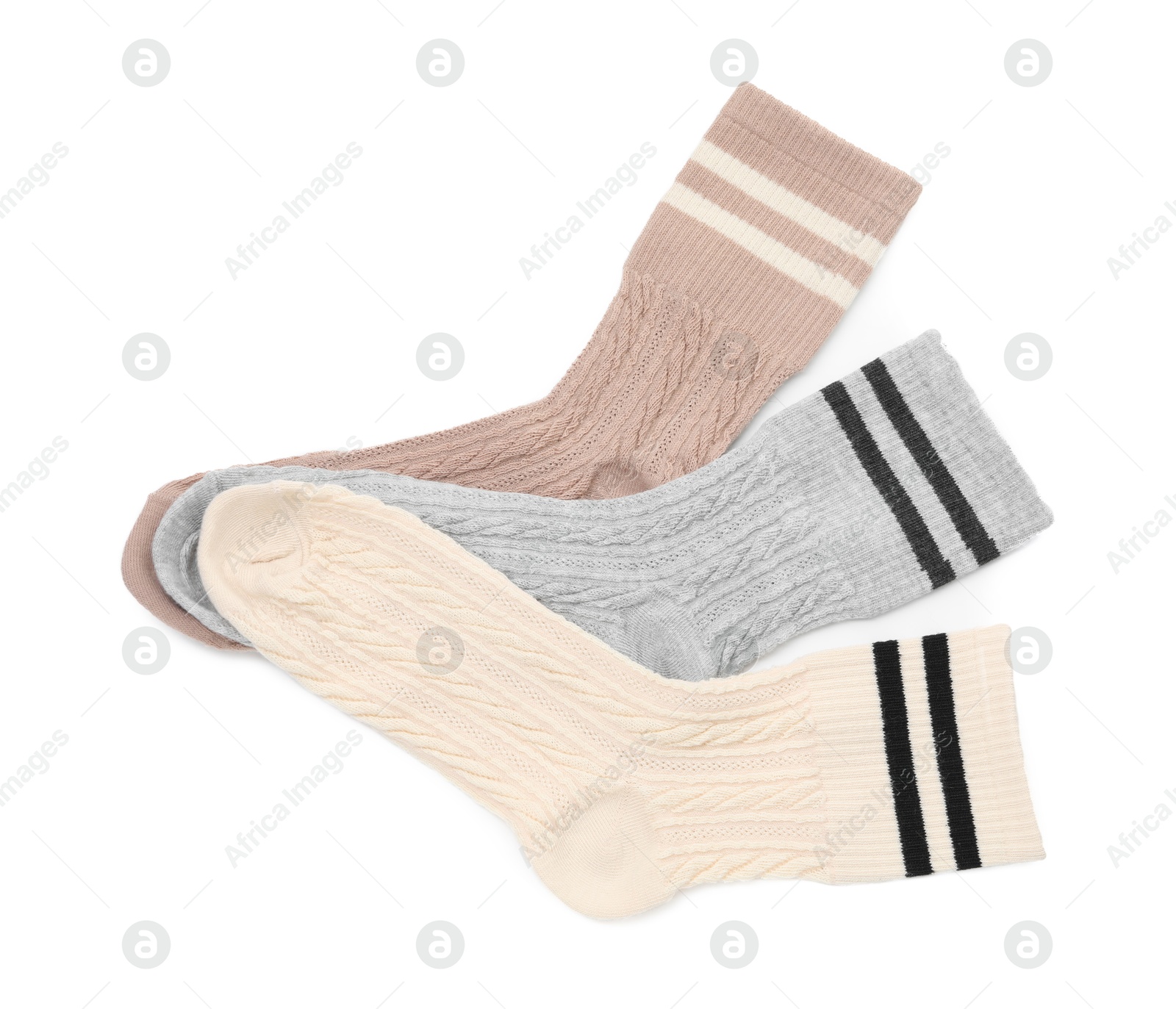 Photo of Different soft socks isolated on white, top view