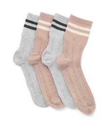 Photo of Different soft socks isolated on white, top view