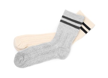 Photo of Pair of colorful socks isolated on white, top view