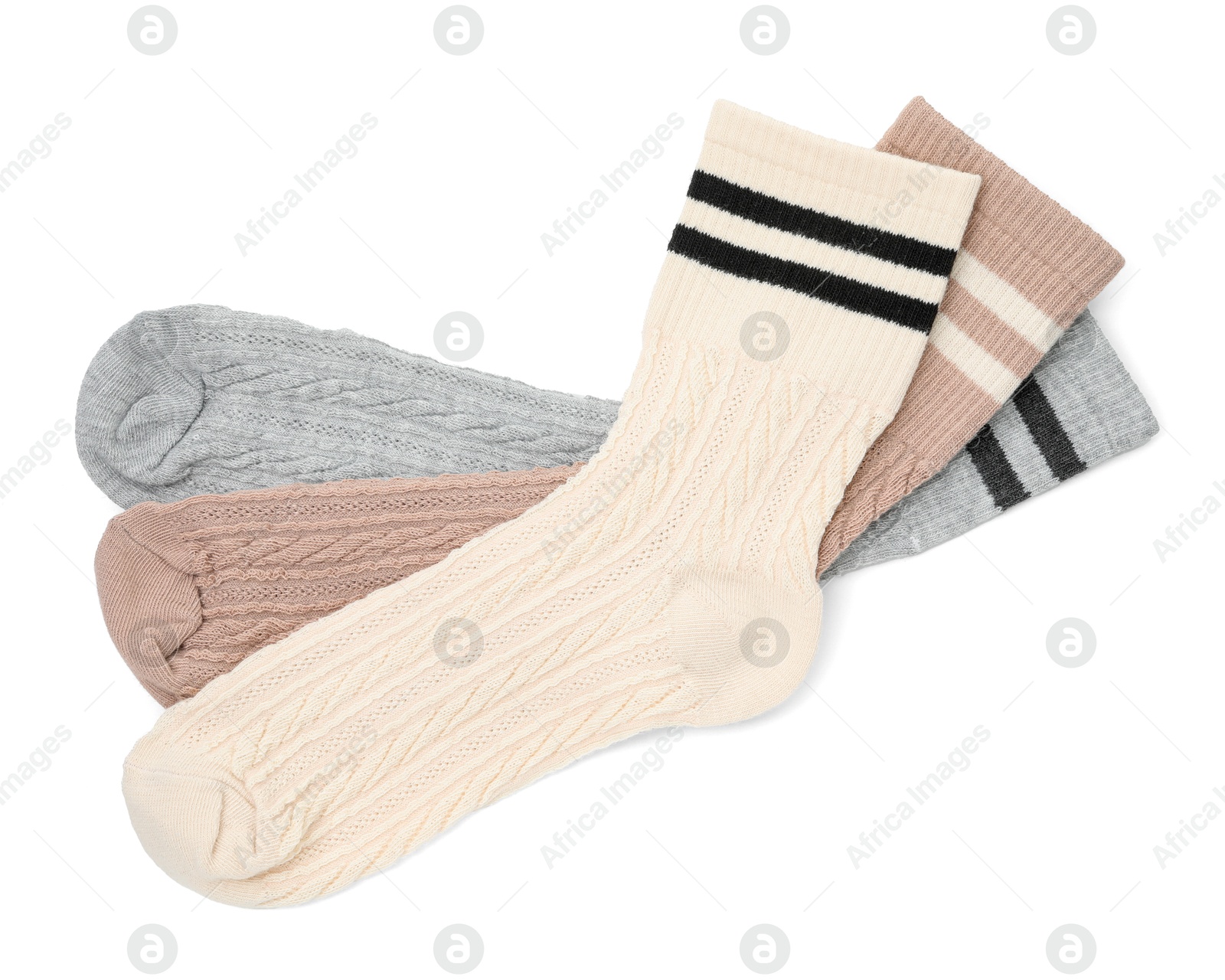 Photo of Different soft socks isolated on white, top view